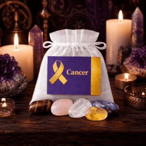 Cancer Support crystal bag on a wooden altar with candles