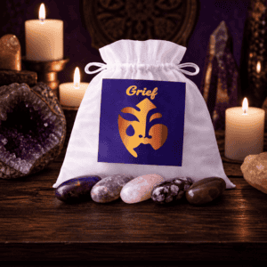 Grief crystal bag on a wooden altar with candles