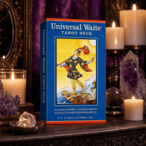 Universal Waite Tarot Deck box on a wooden altar with candles and crystals